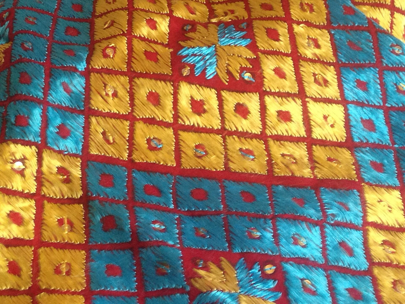 Detail of a hand-embroidered Phulkari textile, the traditional Punjabi wedding shawl worked in bright silk floss
